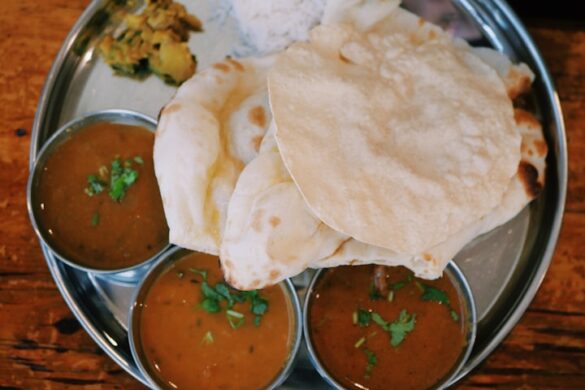 roti in round gray stainless steel tray